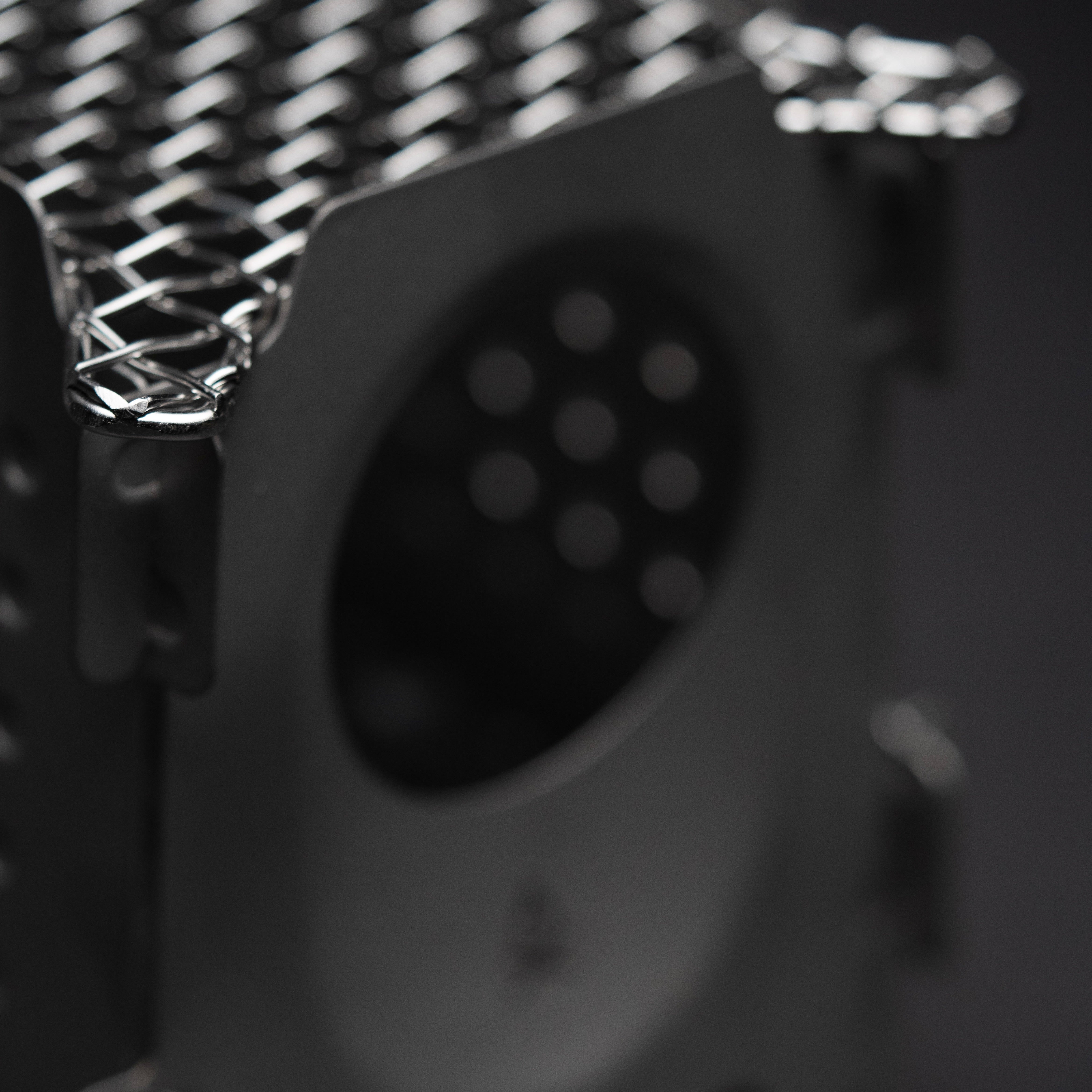 An out of focus image of the Überleben bushcraft Stöker stove.